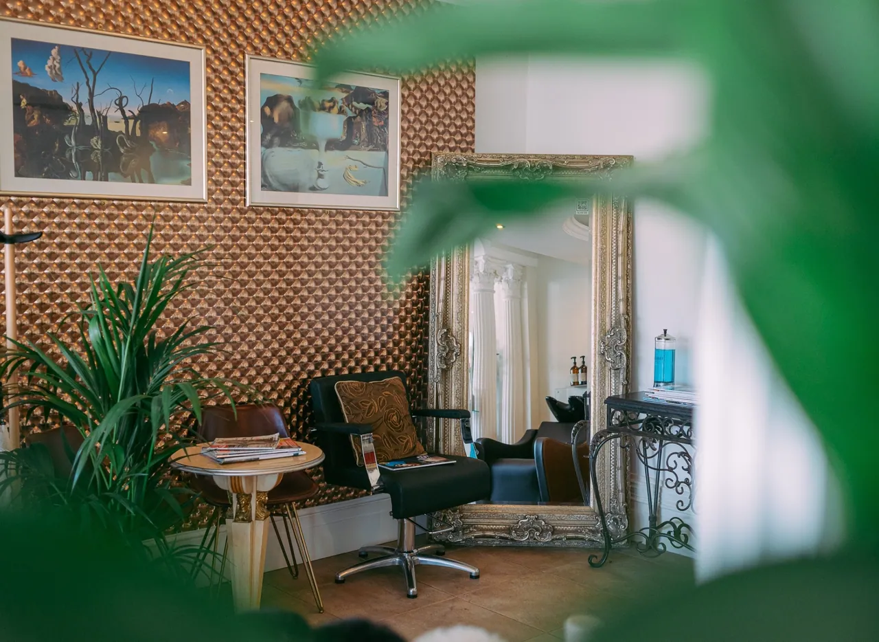Consultation corner with feature wall and gilded mirror