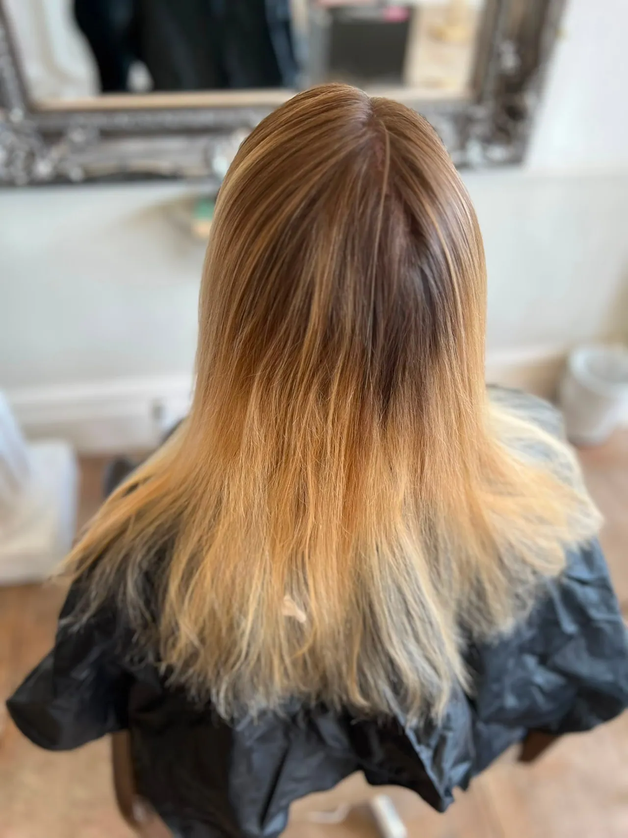 Blonde hair before tape extensions, photographed from above to show natural density